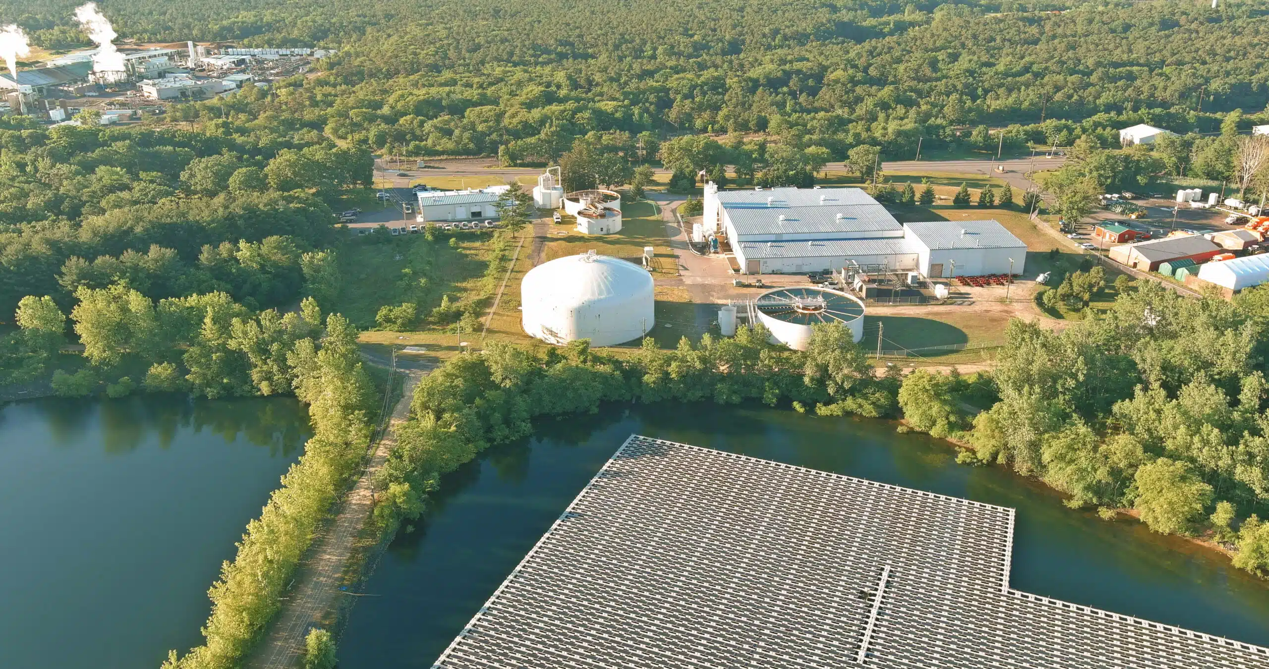 Aerial view of an industrial site with biogas plant and solar park